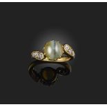 A cat's eye chrysoberyl and diamond ring, late 19th century, set with a cabochon cat's eye