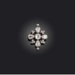 A George III diamond brooch, of quatrefoil design set with graduated cushion-shaped and pear-