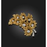 A gold and diamond brooch, 1970s, designed as a spray of flowers in textured gold, set with