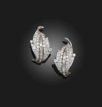 A pair of diamond ear clips, mid 20th century, each designed as a leaf, pavé-set with brilliant-