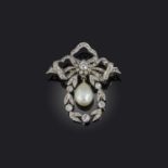 A natural pearl and diamond brooch, circa 1910, designed in the 'garland style', composed of a