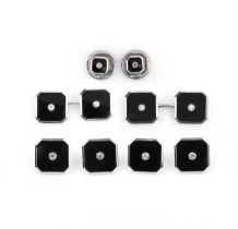 A cased dress set of cufflinks and six studs, each composed of polished onyx centring on a