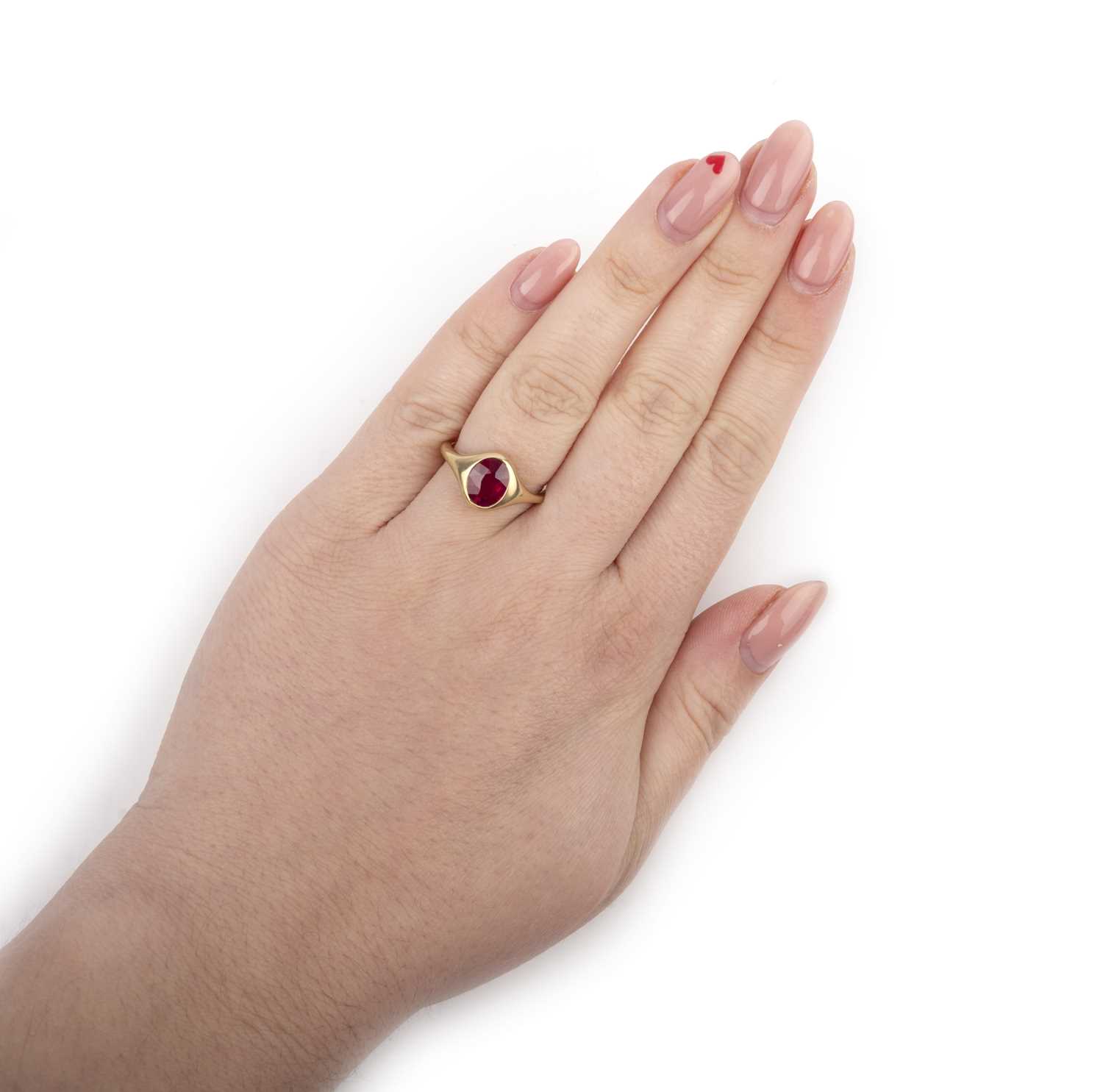 A ruby single-stone ring, rubover-set with an oval ruby weighing 2.09 carats, to a tapering gold - Image 2 of 4