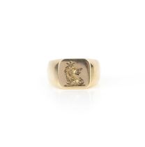 A gold signet ring, the square panel engraved with a crest of a crowned lion, size Q, stamped