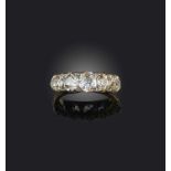 A late 19th century diamond five stone ring, set with graduated old cushion-shaped diamonds and