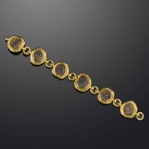 Elizabeth Gage, a gold and bronze bracelet, circa 1998, composed of links set with ancient bronze