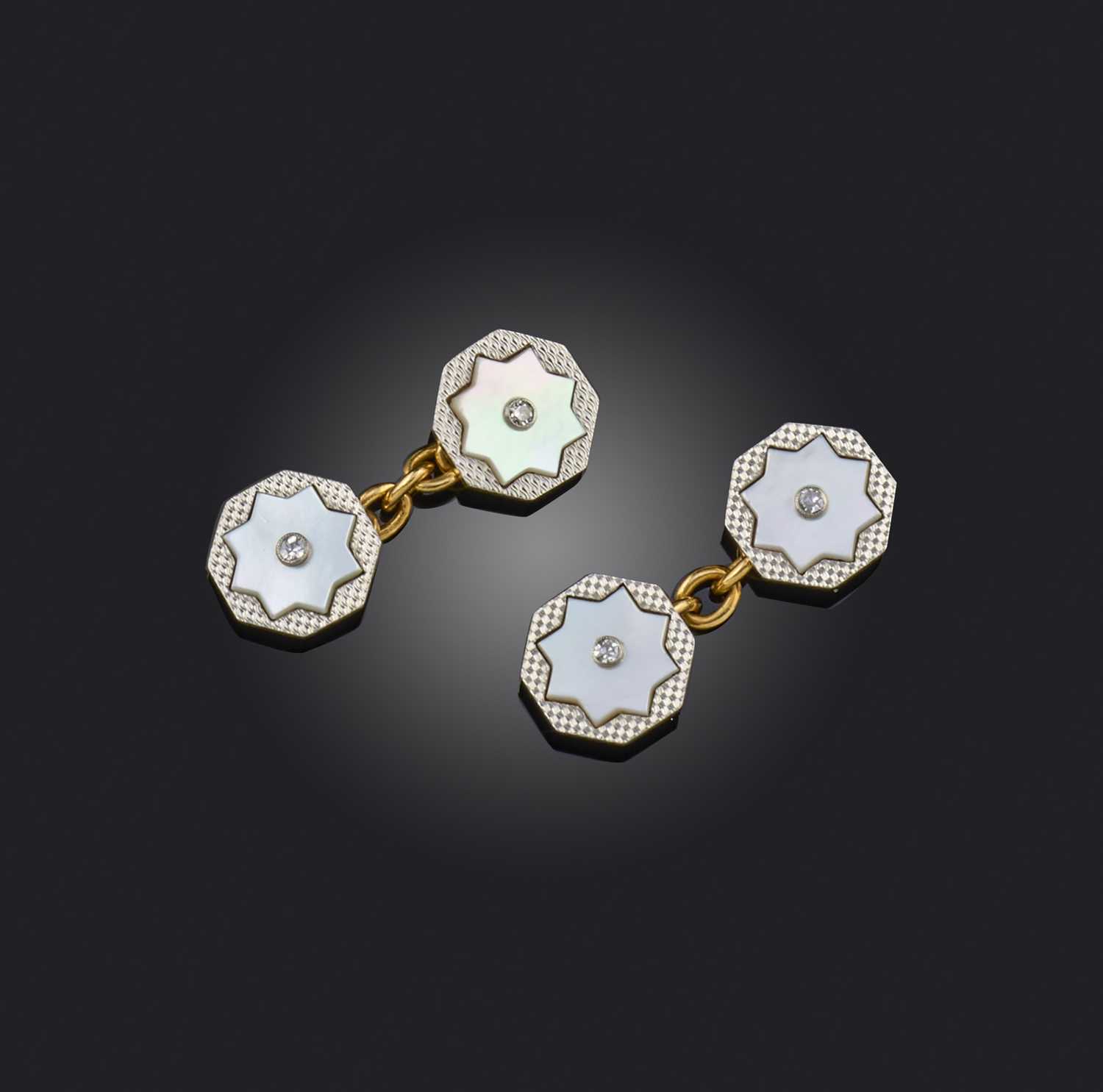 A pair of mother of pearl and diamond cufflinks, early 20th century, each end of octagonal