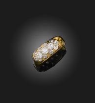 A diamond ring, the 18ct gold band set to the front with clusters of circular-cut diamonds, size