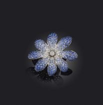 Palmiero, a sapphire and diamond flower ring, pavé-set with graduating blue to paler blue