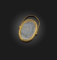 A neoclassical intaglio ring, early 19th century, the pale oval agate engraved with a depiction of
