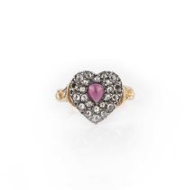 A garnet and diamond ring, centring on a heart-shaped motif set with a cabochon garnet and rose-