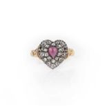 A garnet and diamond ring, centring on a heart-shaped motif set with a cabochon garnet and rose-