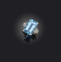 An aquamarine and diamond ring, claw-set with a step-cut aquamarine weighing approximately 15.00