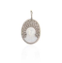 A Belle Epoque mother of pearl, seed pearl and diamond pendant, circa 1900, set with a section of