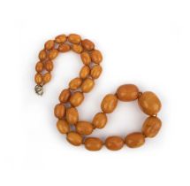 An amber necklace, composed of graduated amber beads measuring approximately 13-30mm, length 71.5cm