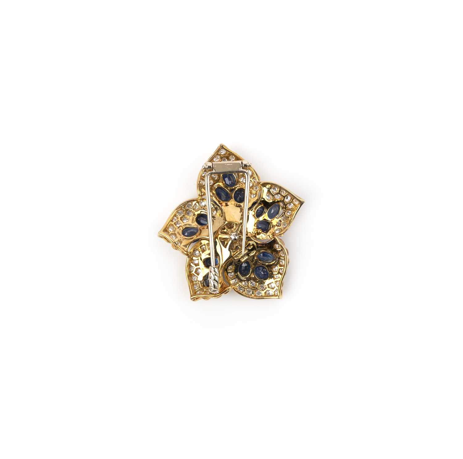 A sapphire and diamond flower brooch, set overall with oval-shaped sapphires within a surround of - Image 2 of 2