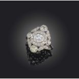 An attractive Belle Epoque diamond ring, circa 1915, designed as a foliate cluster, centring on a