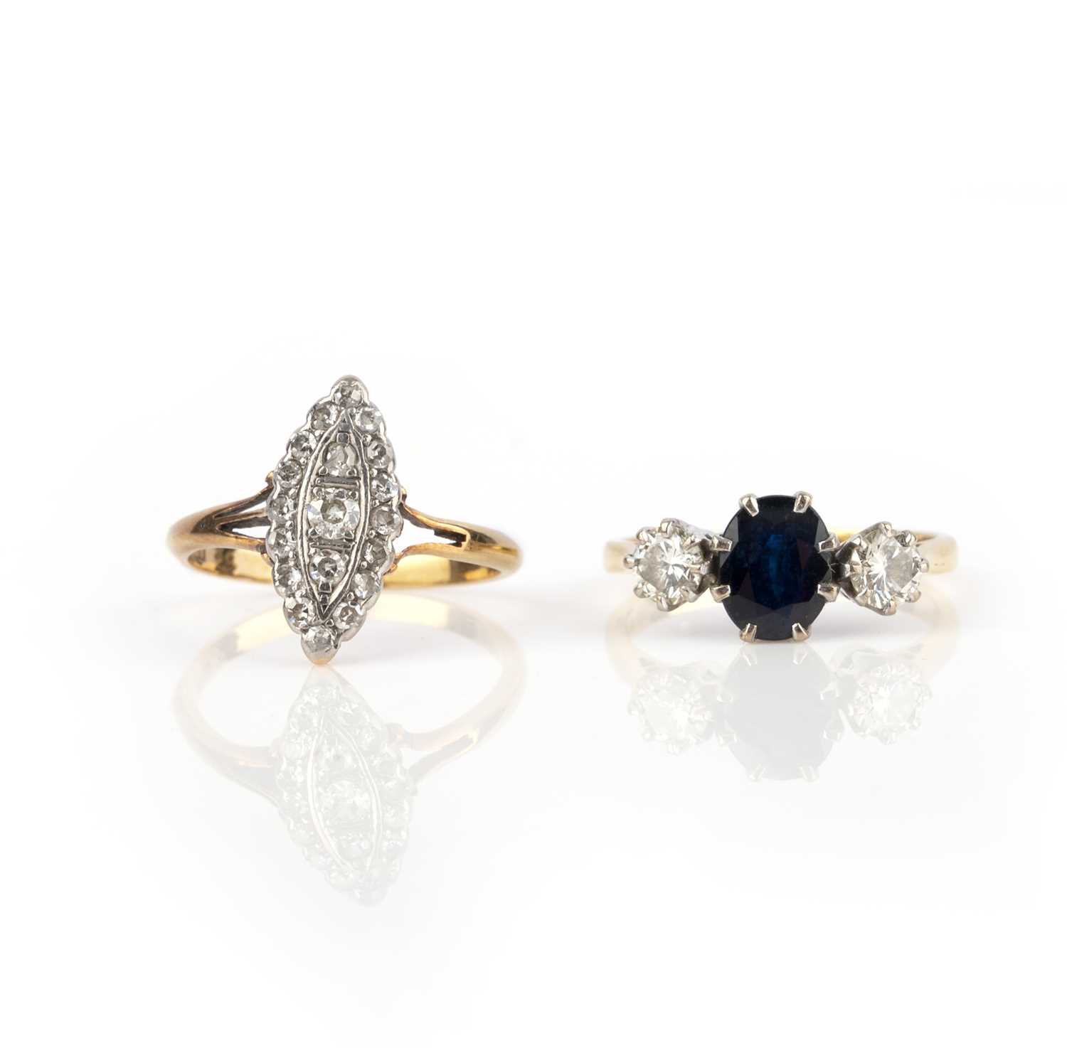 Two gem-set rings, comprising: a navette-shaped ring set with circular-cut and single-cut