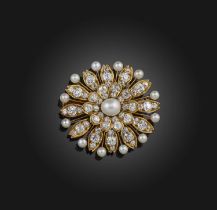 A pearl and diamond brooch, late 19th century, designed as a flower, centring on a pearl measuring