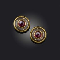 A pair of mother of pearl, rubellite and diamond earrings, each of circular outline, centring on a