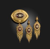 A Victorian garnet and seed pearl demi-parure, late 19th century, comprising: a pair of lozenge-