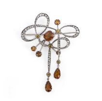 A citrine and diamond brooch, early 20th century, designed in the Art Nouveau style as an abstract