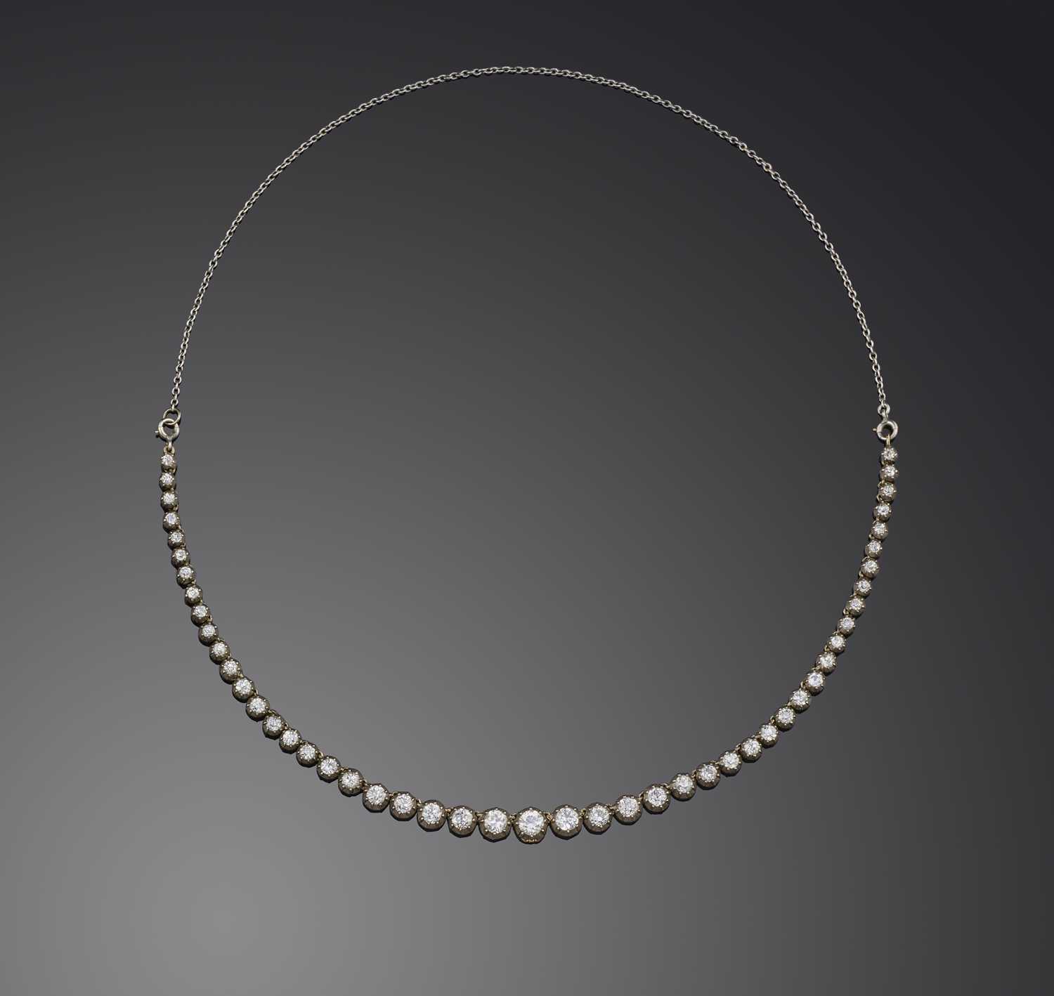 A diamond rivière necklace, late 19th century and later, the front designed as a series of graduated