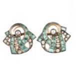 A pair of emerald and pearl earrings, mid 20th century, of stylised ribbon scroll design, set with