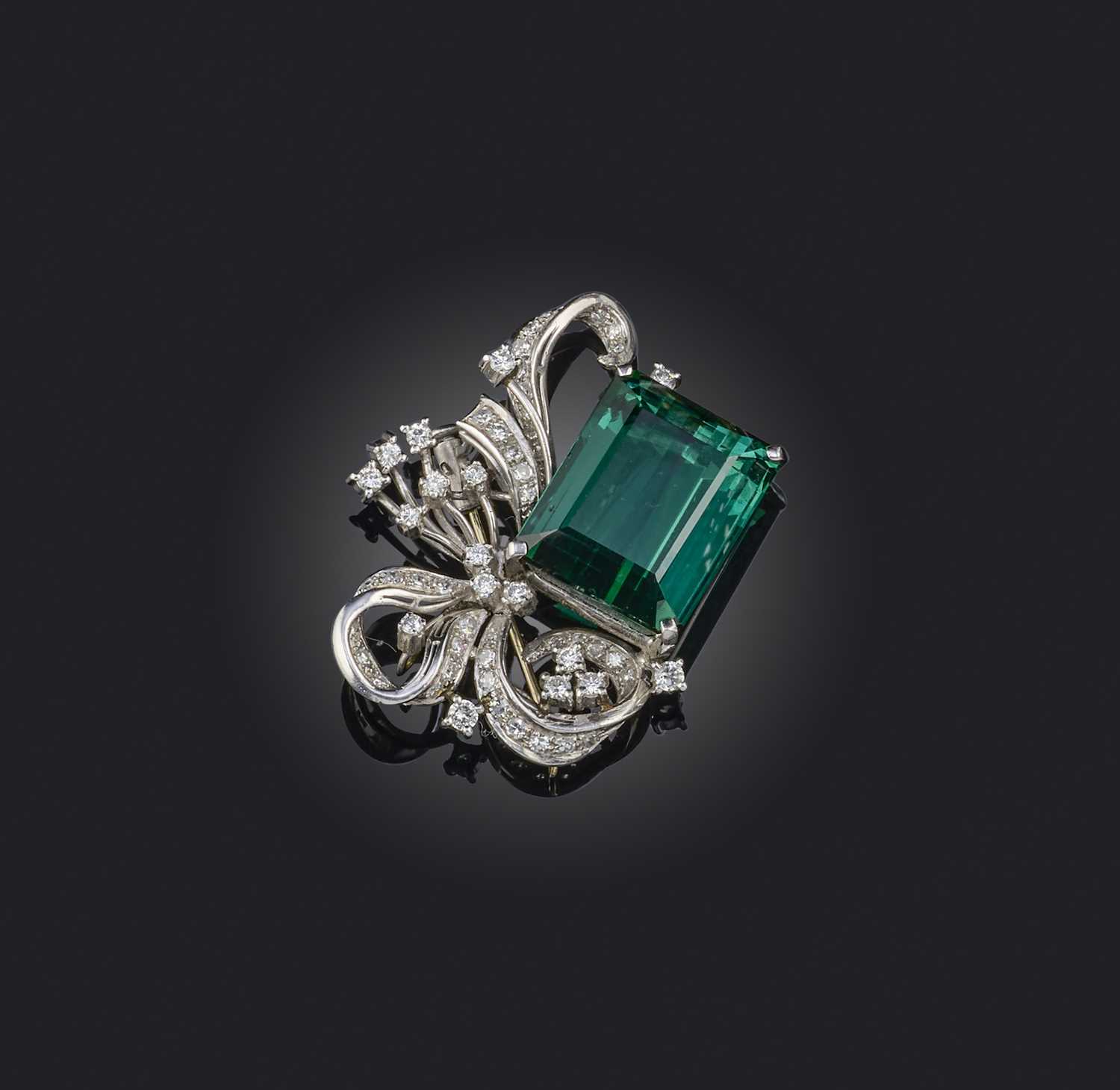 A tourmaline and diamond brooch, set with a step-cut tourmaline of deep bluish green tint weighing