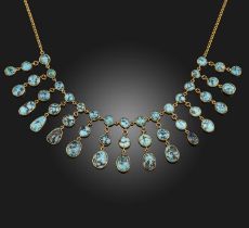 A turquoise necklace, the front suspending a fringe of turquoise cabochon pendants, to a curb link