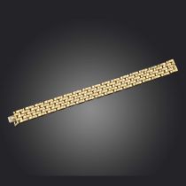 Cartier, a gold bracelet, 'Maillon Panthère', 1990s, of gate link design in 18ct gold, to a