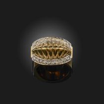 A gold and diamond ring, the centre of raised ridged design, within borders of rose-cut diamonds,