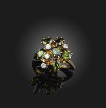 A tourmaline and diamond cluster ring, set with oval green tourmalines and diamonds all claw-set