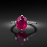 Cartier, a fine ruby and diamond ring, early 20th century, claw-set with an oval ruby weighing 3.