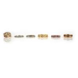 No reserve - a collection of six gold and gem-set rings, comprising: an eternity ring set with