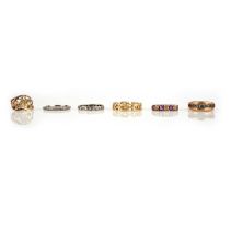 No reserve - a collection of six gold and gem-set rings, comprising: an eternity ring set with