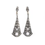 A pair of diamond earrings, each suspending a tapering drop, set with brilliant-cut diamonds