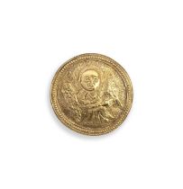 An unusual gold brooch, of Lombardic inspiration, designed as a circular medallion with repoussé and