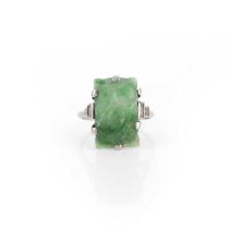 An Art Deco jadeite and diamond ring, 1920s, claw-set with a rectangular jadeite carved with fruit