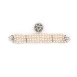 Vourakis, a cultured pearl, emerald and diamond bracelet, the clasp of floral design, set with