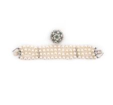 Vourakis, a cultured pearl, emerald and diamond bracelet, the clasp of floral design, set with