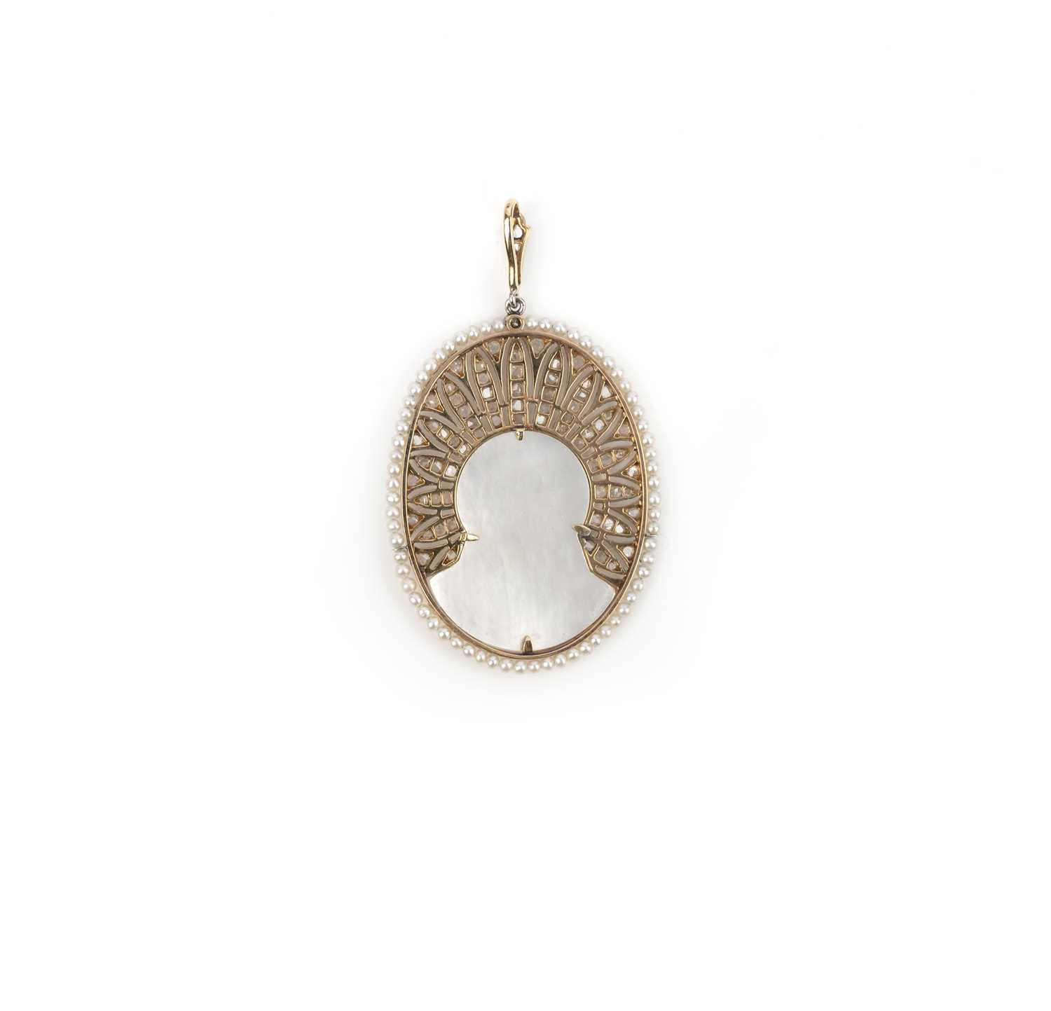 A Belle Epoque mother of pearl, seed pearl and diamond pendant, circa 1900, set with a section of - Image 2 of 2