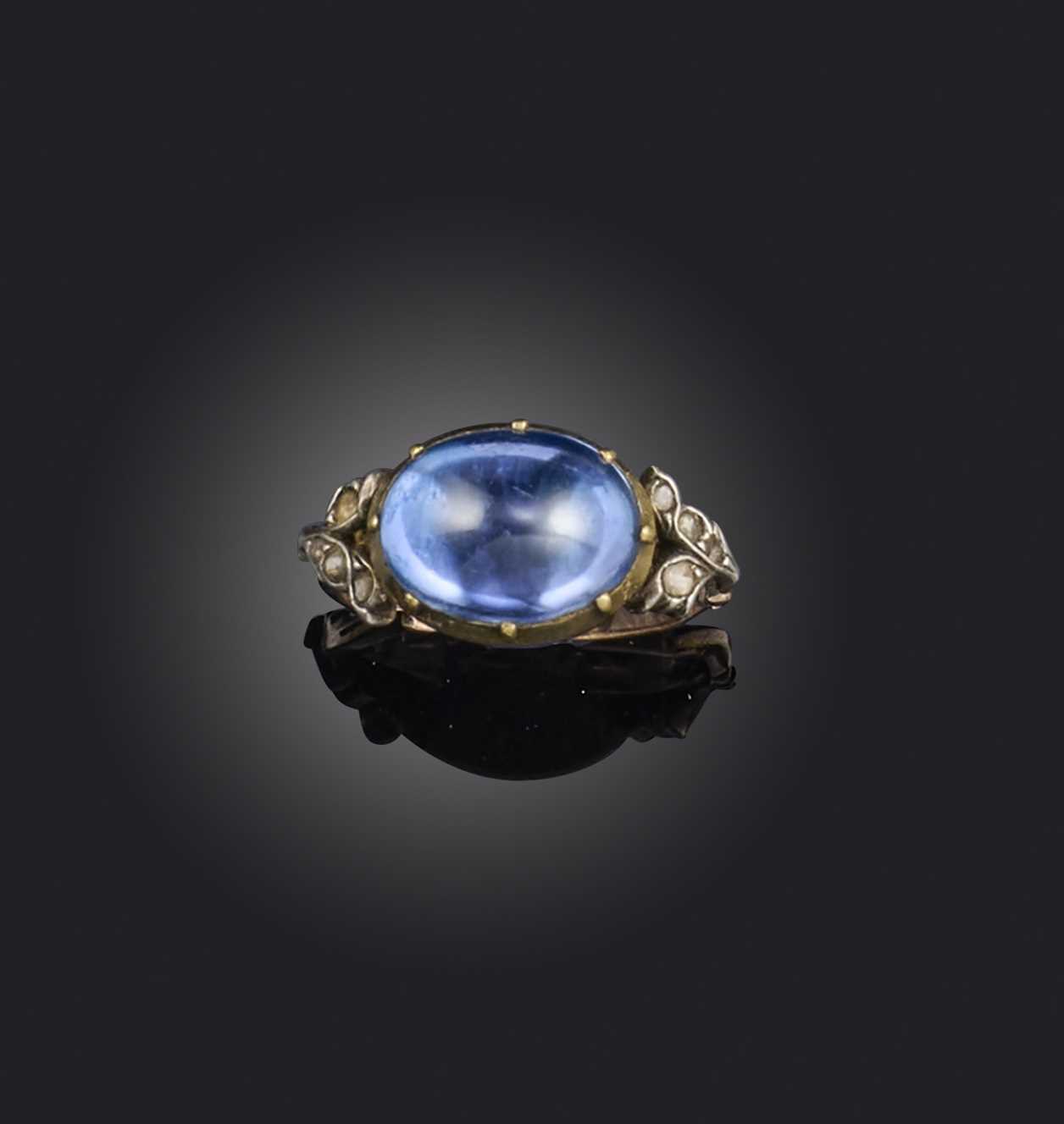 A sapphire and diamond ring, late 18th century composite, set with a cabochon sapphire within