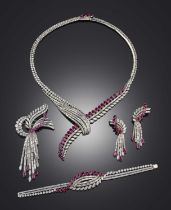 An impressive ruby and diamond parure, 1960s, comprising: a necklace, a pair of ear clips, a