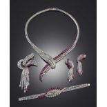 An impressive ruby and diamond parure, 1960s, comprising: a necklace, a pair of ear clips, a