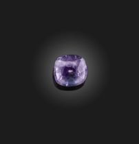 † † A loose cushion-shaped purple sapphire, weighing 3.69cts A verbal report from GCS states that