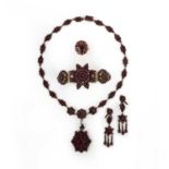 No reserve- A collection of garnet jewellery, comprising: a demi-parure of a necklace, bracelet