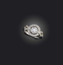 A diamond cluster ring, set with a central circular-cut diamond weighing approximately 0.80cts