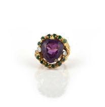 Hooper Bolton, an amethyst, emerald and diamond ring, circa 1968, set with a pear-shaped amethyst,