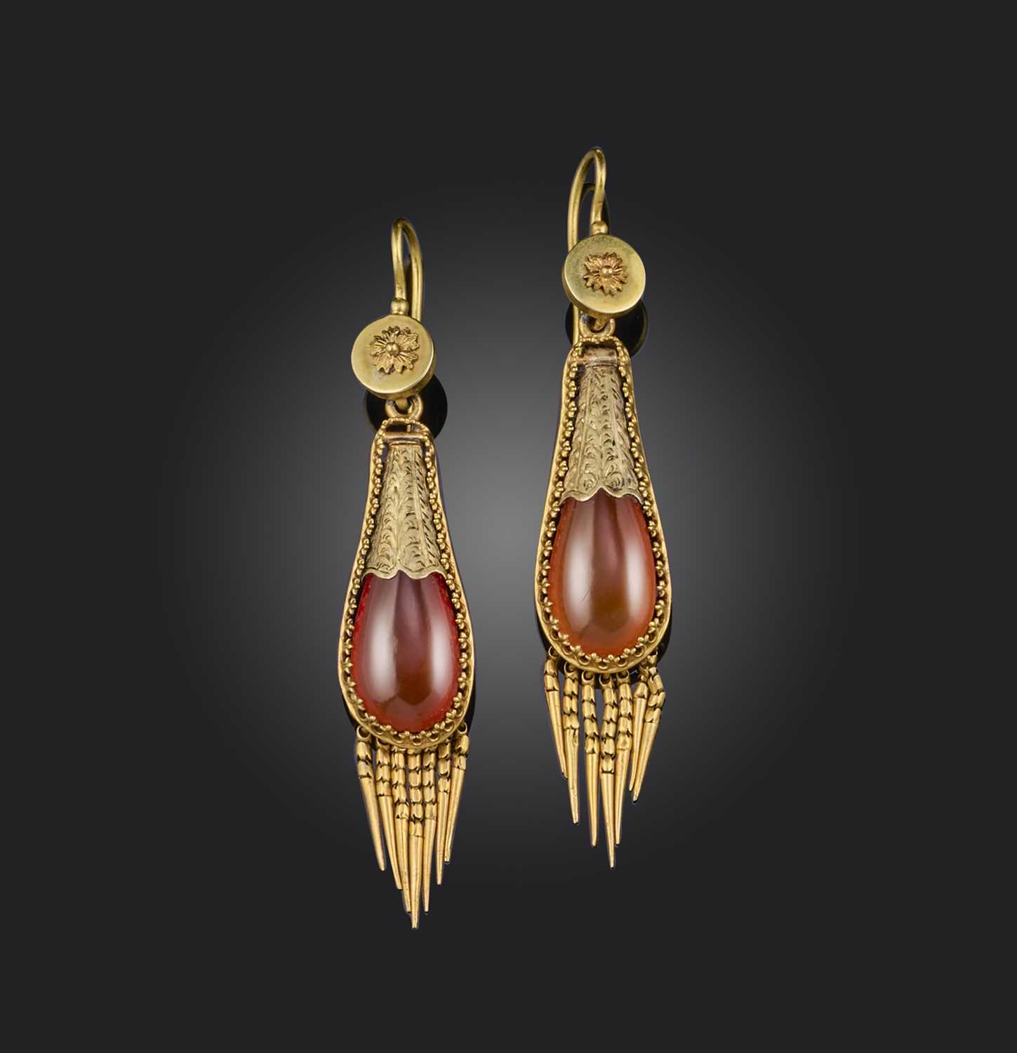 A pair of carnelian earrings, mid 19th century, each of drop design, set with polished carnelian,